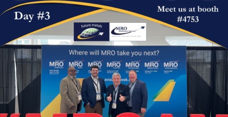 Extrusions, aircraft, aerospace, metal supplier, metals Five executives at the Future Metals' booth during MRO Americas conference, showcasing durable aircraft-grade Titanium Ti-6AL-4V alloy, amidst event signage.